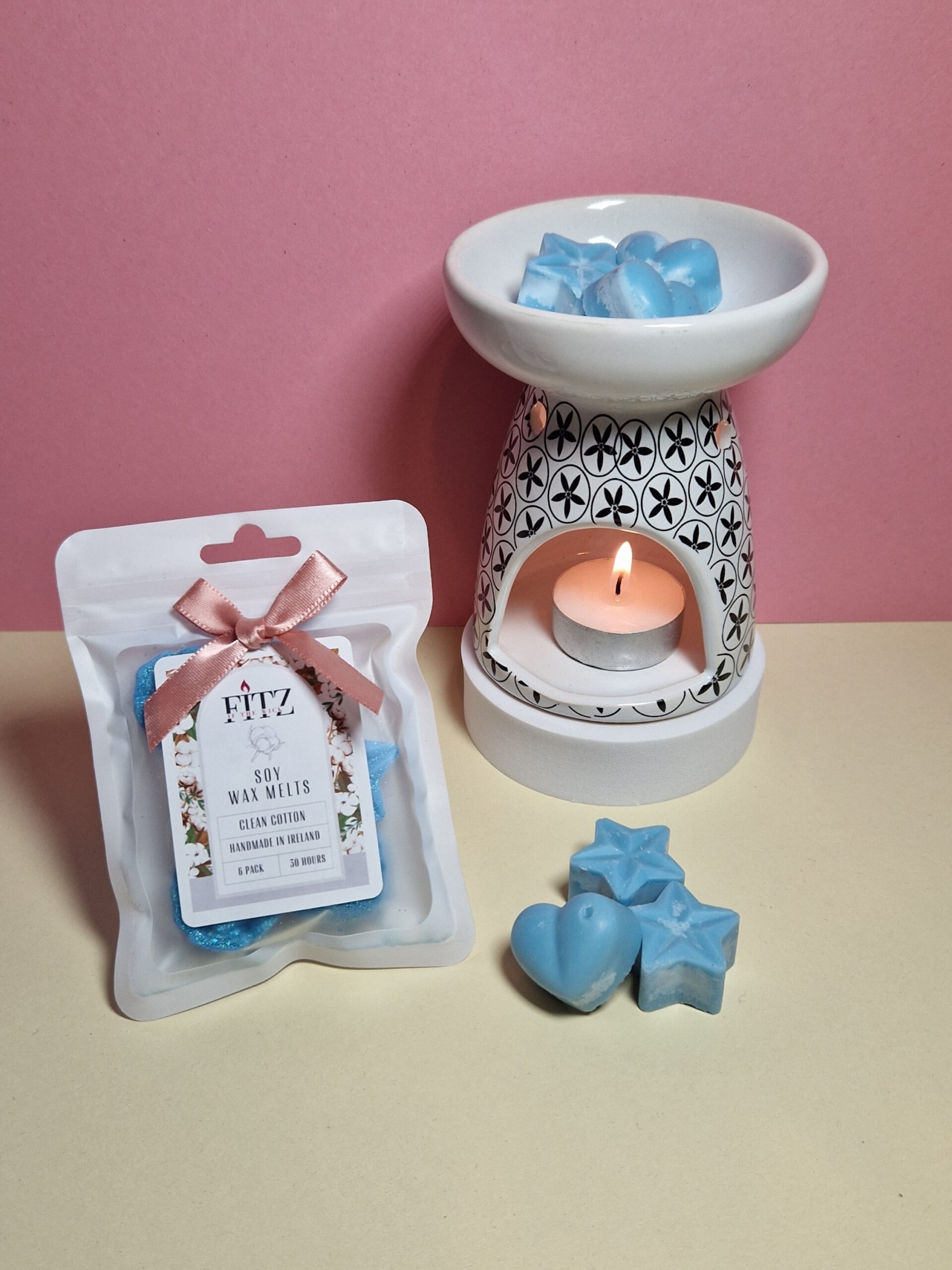 Clean Cotton wax melts in a packet next to a wax burner