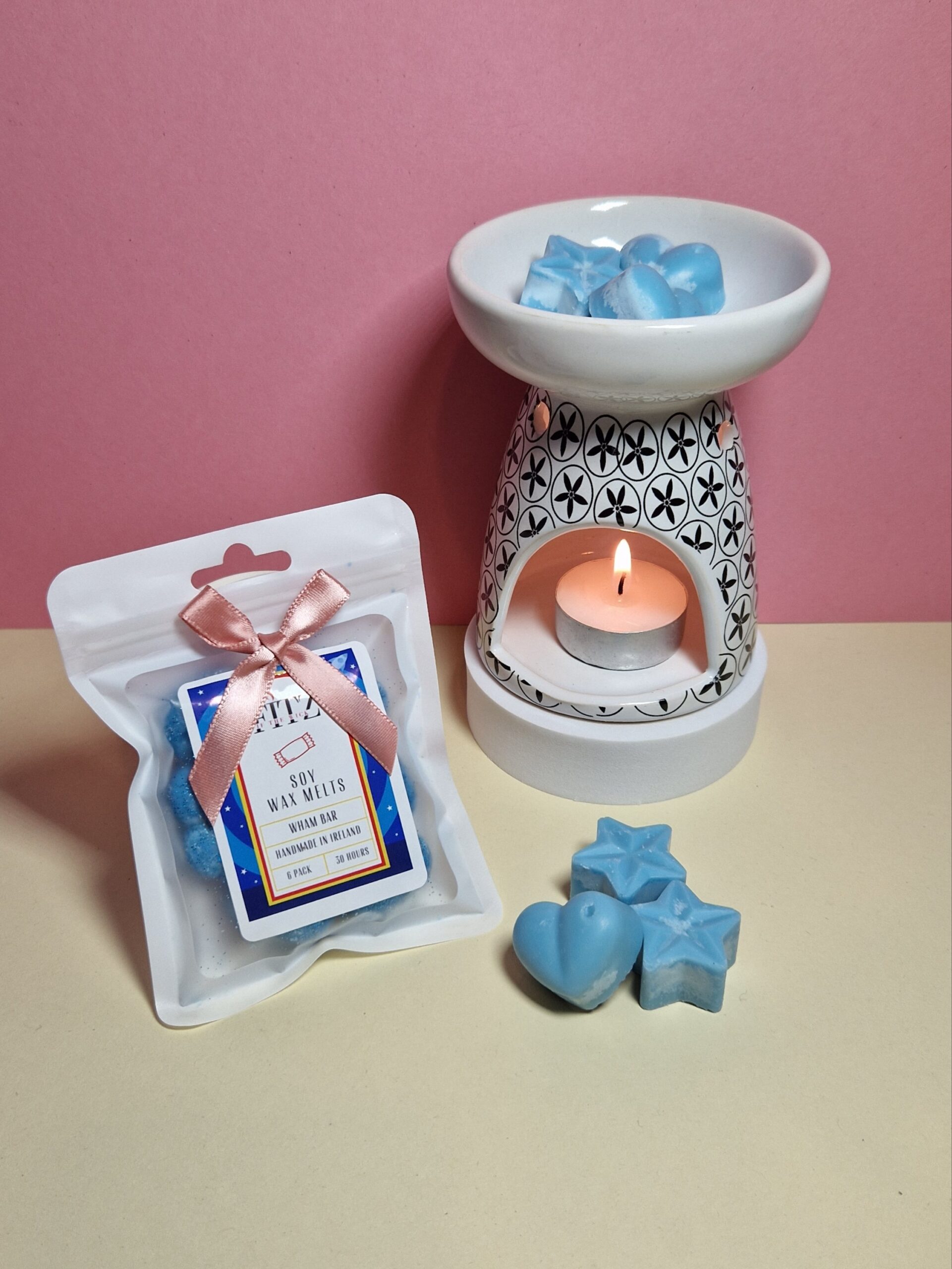 Wham Bar wax melts in a packet next to a wax burner