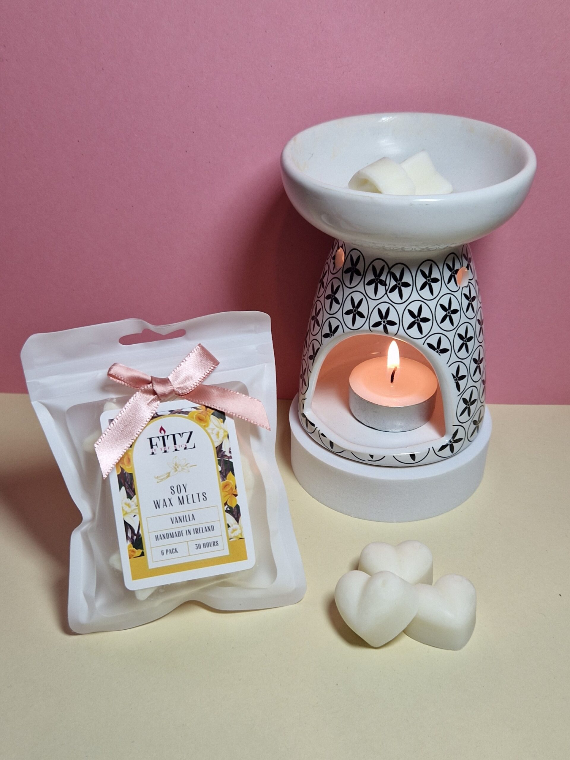 Vanilla wax melts in a packet next to a wax burner