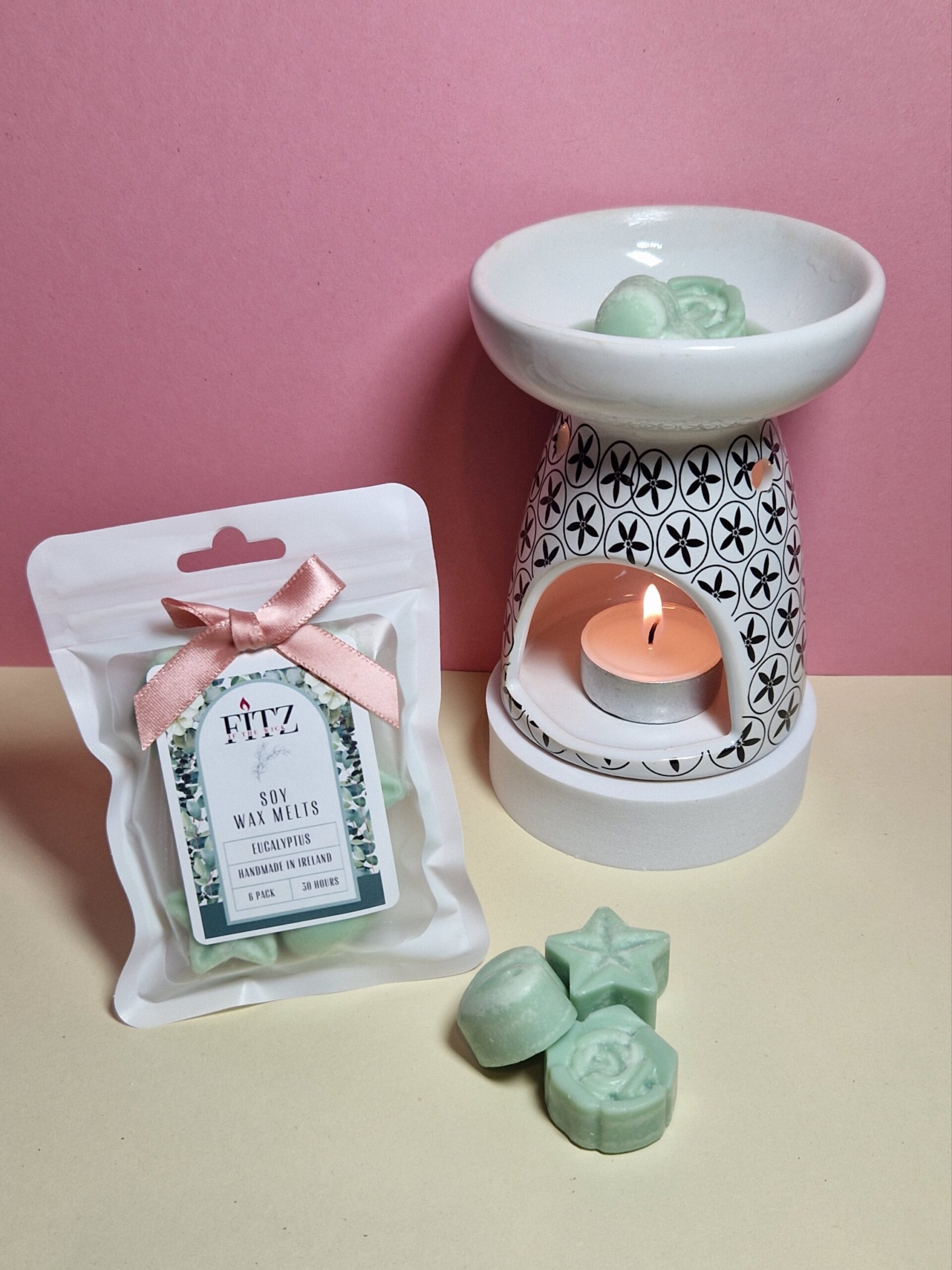 Eucalyptus wax melts in a packet next to a wax burner