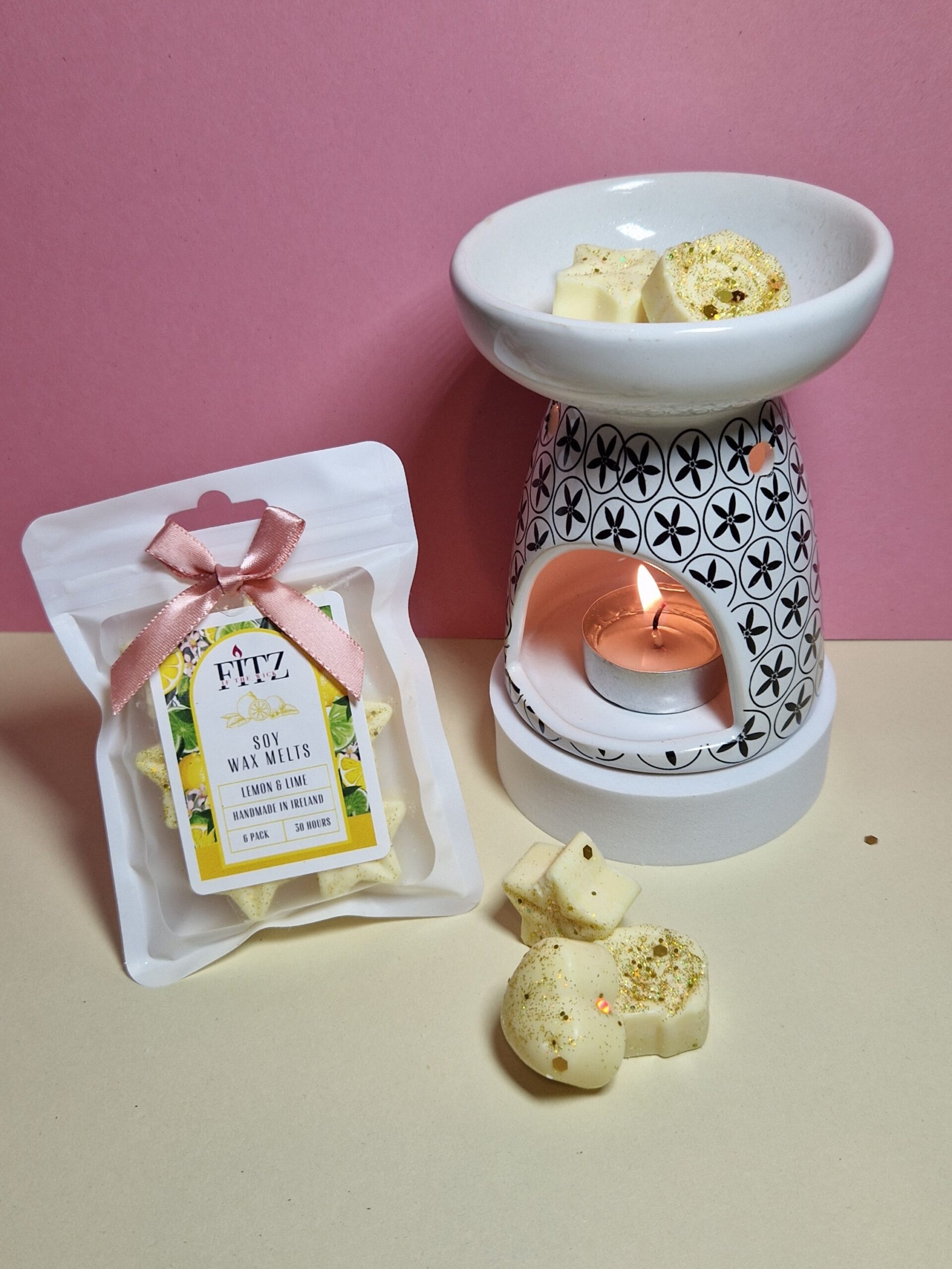 Lemon & Lime wax melts in a packet next to a wax burner