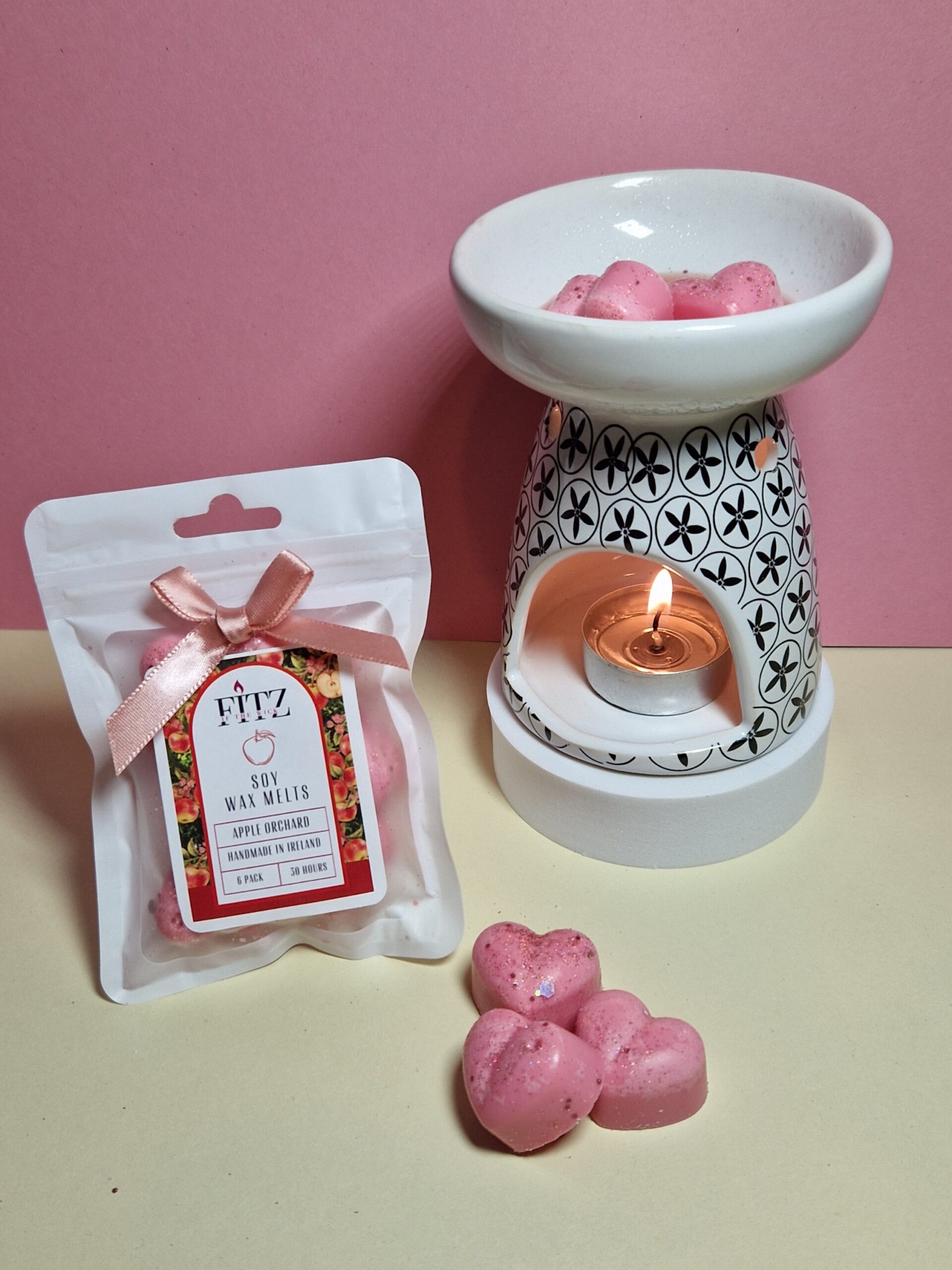 Apple wax melts in a packet next to a wax burner