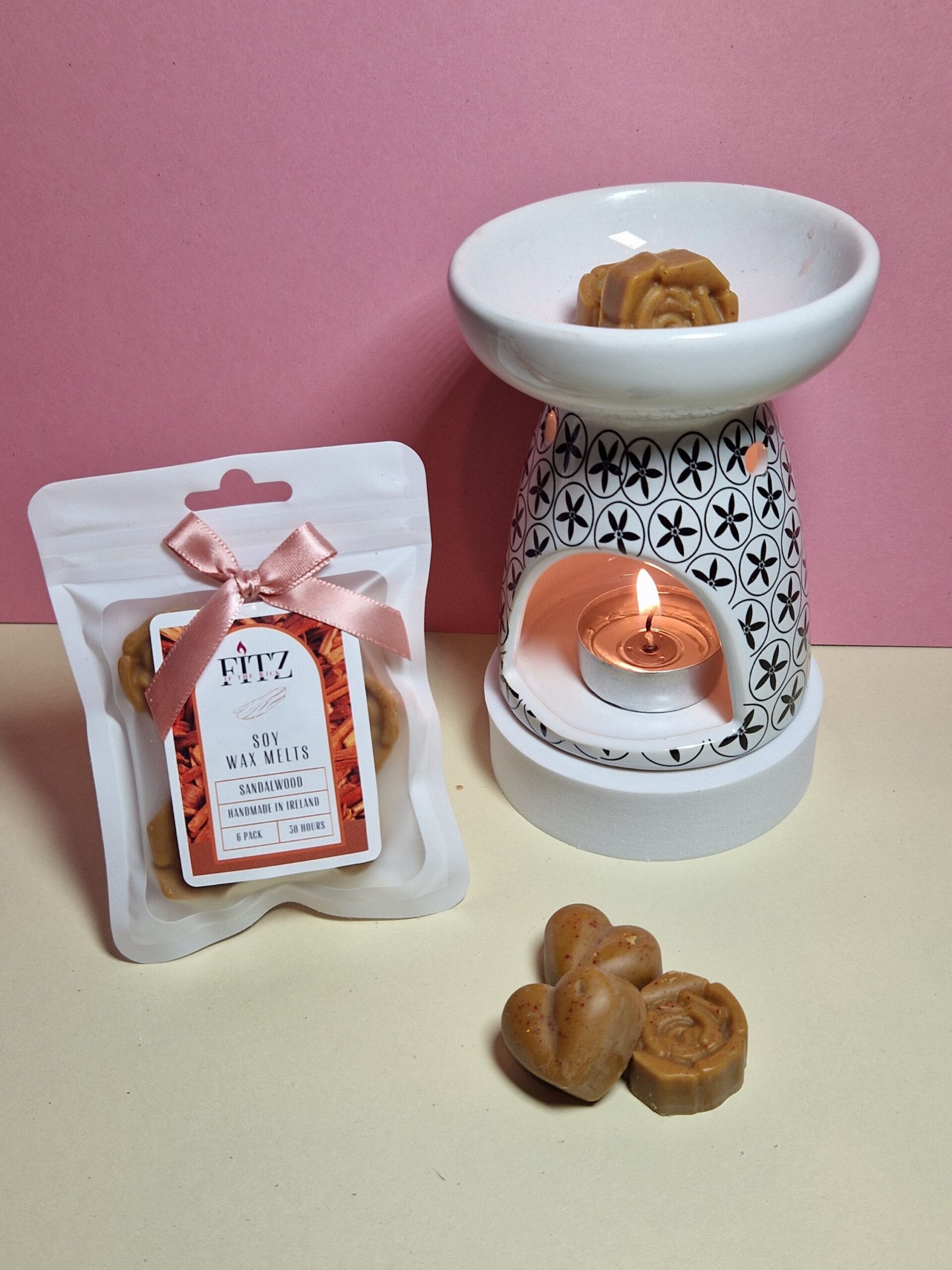 Sandalwood wax melts in a packet next to a wax burner